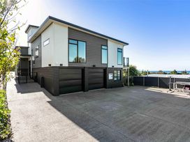 A house with garage and driveway at Island Views - Waihi Beach Holiday Home, Waihi Beach