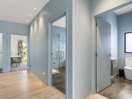 A bathroom with a toilet and sink at Island Views - Waihi Beach Holiday Home