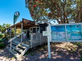 An information centre with a map and signage at Central Beach Pad - Waihi Beach Holiday Home in Waihi Beach