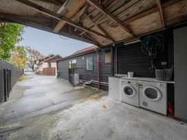 A garage with washing machine and dryer at Te anau holiday home in Te Anau
