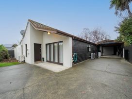 A house with a carport and garden at Te anau holiday home in Te Anau