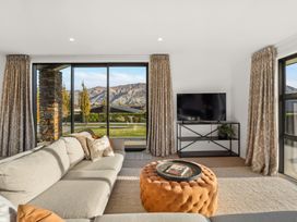 A living room with a sofa and coffee table at Mako Haven - Mountain Outlook in Wanaka