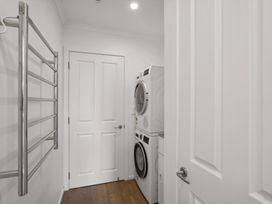 A laundry room with a washing machine and dryer at Mako Haven - Mountain Outlook Wanaka