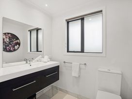A bathroom with a sink and toilet at Mako Haven - Mountain Outlook in Wanaka