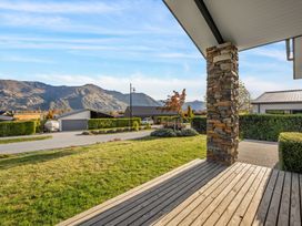 A view of mountains and grass from a deck at Mako Haven - Mountain Outlook in Wanaka