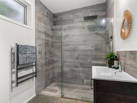 A bathroom with a shower and sink at Sweet Seabreeze - Mangawhai Heads Holiday Home, Mangawhai