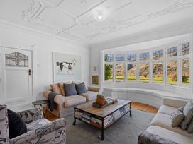 A living room with two couches and a coffee table at Cromwell Holiday Home in Cromwell