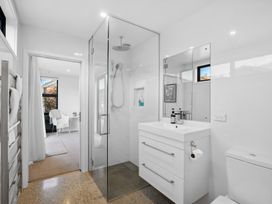 A bathroom with a shower and sink at Cromwell Holiday Home in Cromwell