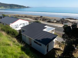 An outdoor view of houses by the beach at Ahipara in Kaitaia
