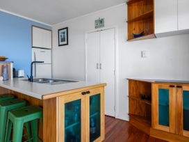A kitchen with a sink and countertop at Ahipara in Kaitaia