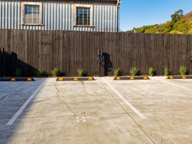 An outdoor parking lot with electric vehicle chargers at Ocean Whisper Retreat - Kaikoura Holiday Home Kaikoura