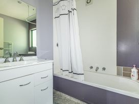 A bathroom with a sink and bathtub at Alpine Charm - Ohakune Holiday Home Ohakune