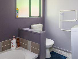 A bathroom with a bathtub, toilet, and sink at Alpine Charm - Ohakune Holiday Home, Ohakune