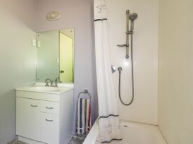 A bathroom with a sink and a shower at Alpine Charm - Ohakune Holiday Home in Ohakune