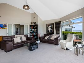 A living room with a sofa and coffee table at Wellington Holiday in Wellington