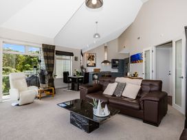 A living room with a sofa and dining table at Wellington Holiday in Wellington