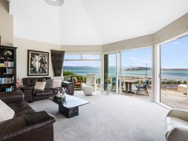 A living room with a sofa and coffee table at Wellington Holiday in Wellington