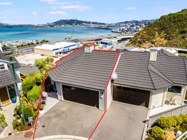 An outdoor view of a garage and driveway at Wellington Holiday in Wellington