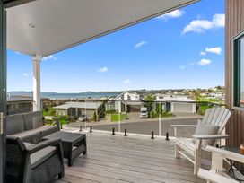 An outdoor seating area with a view at Kawau Bay Escape - Snells Beach