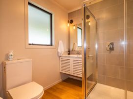 A bathroom with a shower and toilet at Alpine Retreat - Ohakune Holiday Home Ohakune