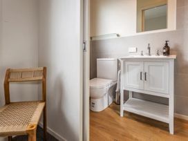 A bathroom with a toilet and sink at Alpine Retreat - Ohakune Holiday Home, Ohakune