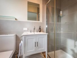 A bathroom with a shower and sink at Alpine Retreat - Ohakune Holiday Home in Ohakune