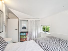 A bedroom with a bed and window at Wellington Holiday home in Wellington