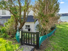 A house with a garden and pathway at Wellington Holiday home in Wellington