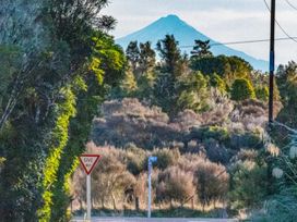 A mountain view with trees and a give way sign at Taylor Lodge Adventure Base - Erua Holiday Home National Park