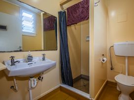 A bathroom with a sink, toilet, and shower at Taylor Lodge Adventure Base - Erua Holiday Home, National Park