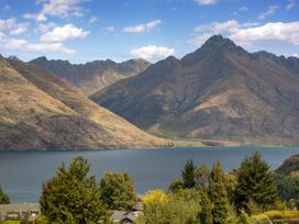 A scenic view of mountains and a lake at Alpine Luxe - Queenstown Holiday Home, Queenstown
