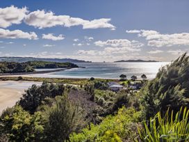 A coastal view with houses and foliage at Coastal Serenity - Te Tii Escape