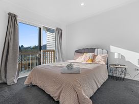 A bedroom with a bed and a bedside table at Hamilton