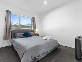 A bedroom with a bed and window at Hamilton in Hamilton