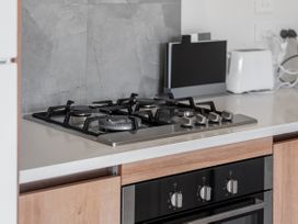 A kitchen with a gas stove and oven at Hamilton in Hamilton