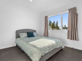 A bedroom with a bed and window at Hamilton in Hamilton