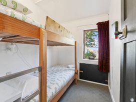 A bedroom with a bunk bed and window at Ohakune
