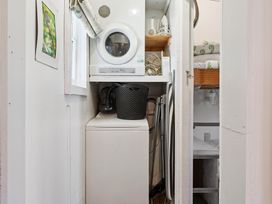 A laundry room with a washing machine and dryer at Ohakune