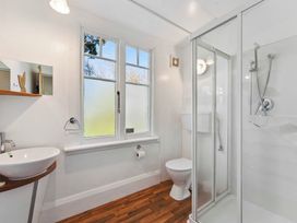 A bathroom with a sink toilet and shower at Ohakune