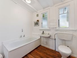 A bathroom with a bathtub and sink at Ohakune