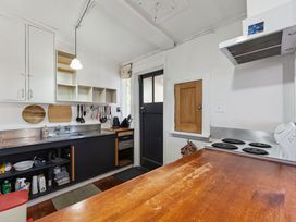 A kitchen with a sink and stove at Ohakune