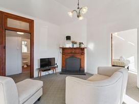 A living room with a fireplace and television at Ohakune