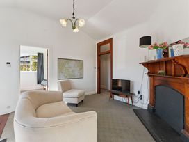 A living room with a sofa and television at Ohakune