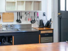 A kitchen with a sink and utensils at Ohakune