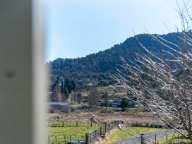 A view of trees and a mountain from a property at Ohakune