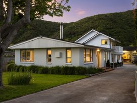 A house with a garden and driveway at Bayview Haven - Waikawa Retreat in Picton