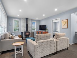 A living room with a couch and chairs at Bayview Haven - Waikawa Retreat in Picton