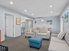 A living room with sofas and armchairs at Bayview Haven - Waikawa Retreat in Picton