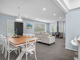 A living room with dining table and sofa at Bayview Haven - Waikawa Retreat in Picton