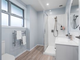 A bathroom with a shower and sink at Bayview Haven - Waikawa Retreat in Picton